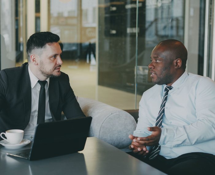 Two professionals meeting to discuss a project